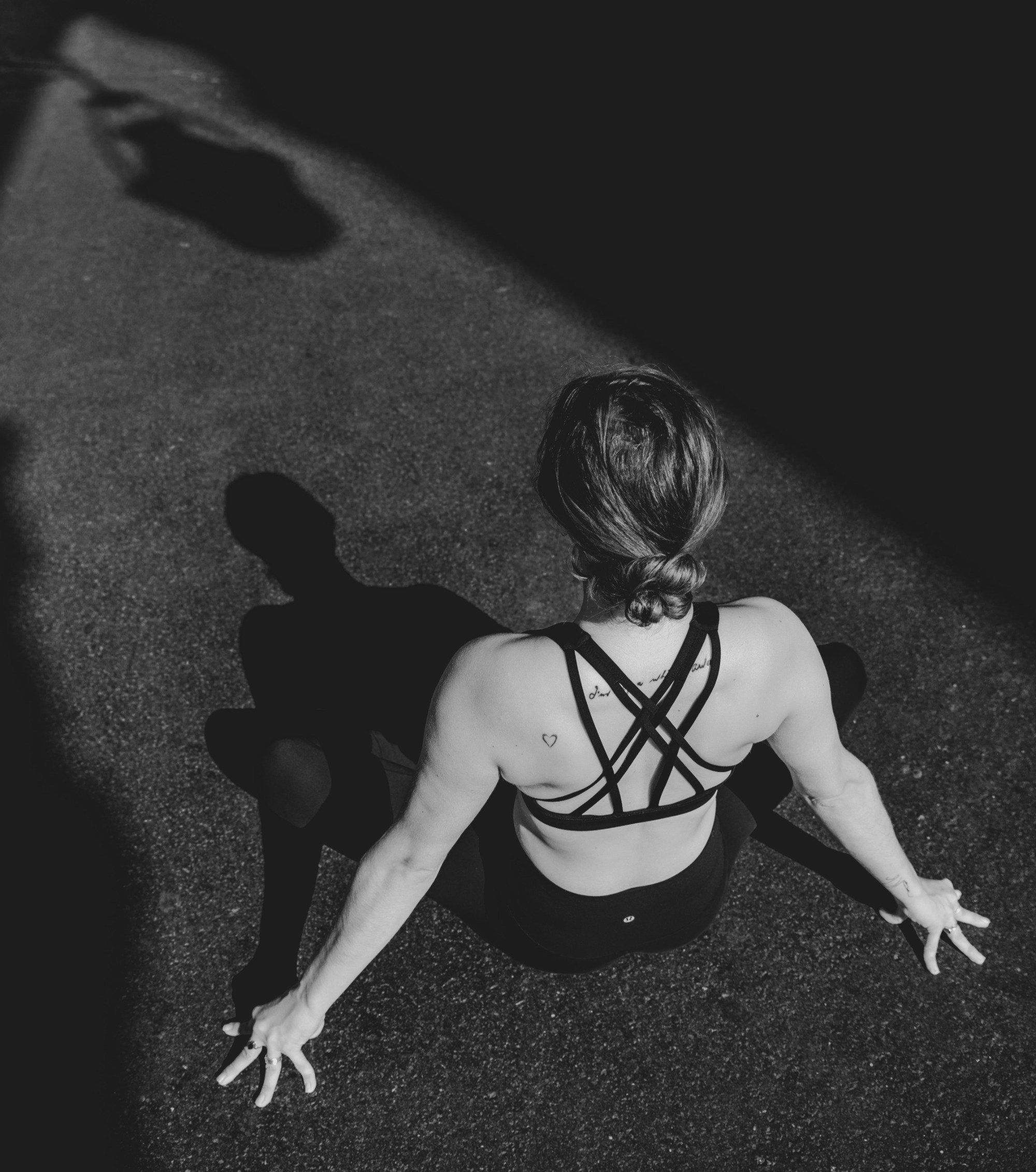 Caitlin Maree Hart in a yoga pose, embodying presence
